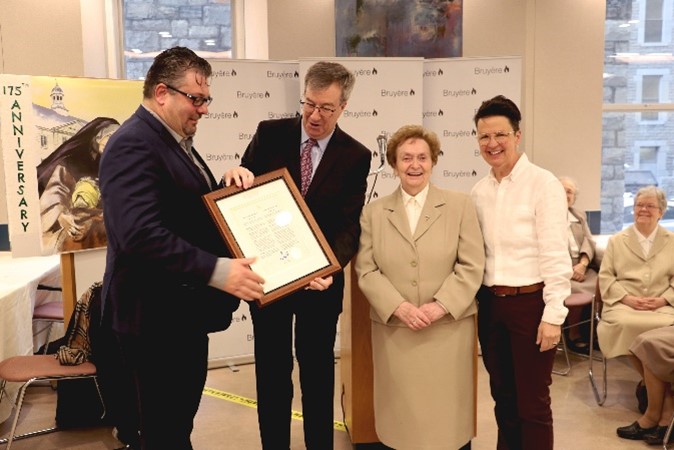 Bruyère President and CEO Guy Chartrand, Mayor Jim Watson, Sister of Charity, and City councilor Catherine McKenney celebrate Élisabeth Bruyère Day